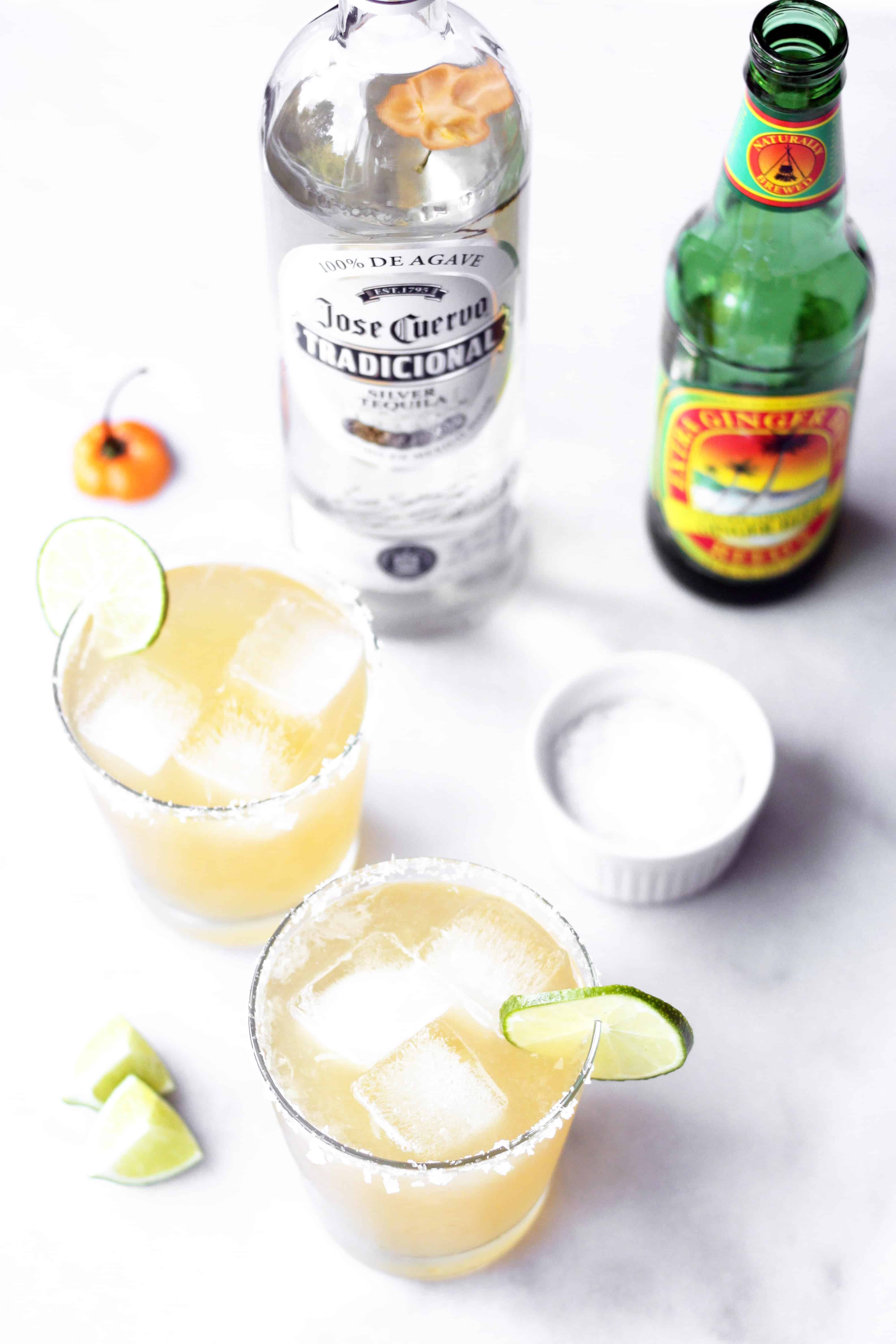 Spicy Habanero ginger beer margarita in glass with ice and lime and salted rim