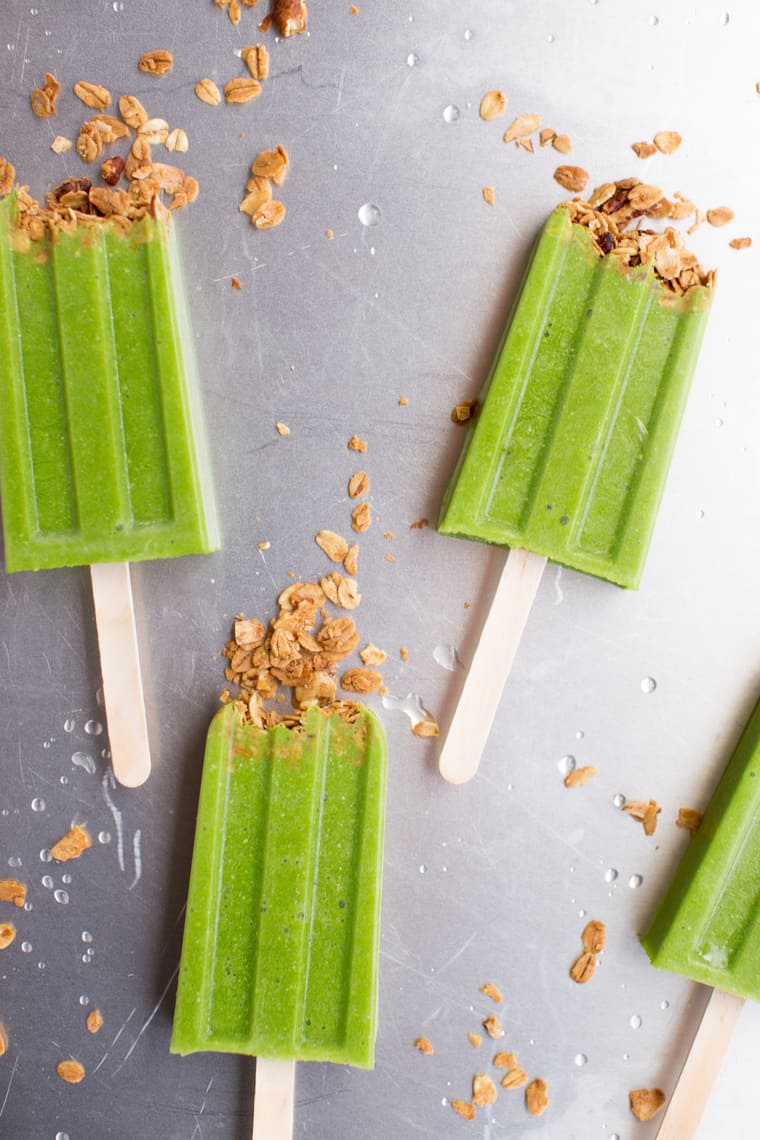 healthy green smoothie popsicles with crunchy granola topping